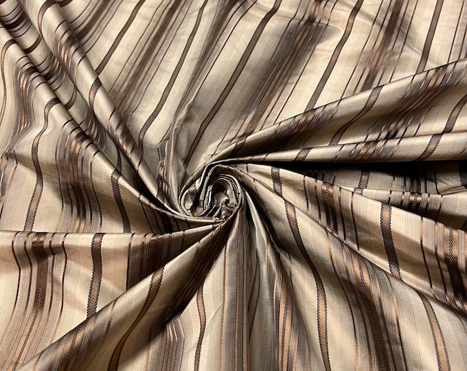 100% silk beautiful brown gray tan gold copper shades with gold satin stripes.  silk satin taffeta 54" wide            Sold by the yard