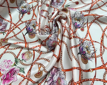 100% silk satin charmeuse digital print 54" wide    Beautiful ivory base with gold pink blue floral print silky soft fabric 54” wide