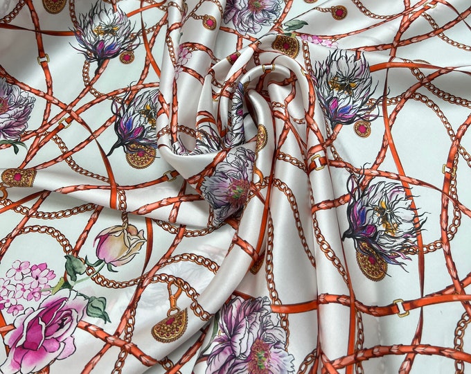 100% silk satin charmeuse digital print 54" wide    Beautiful ivory base with gold pink blue floral print silky soft fabric 54” wide