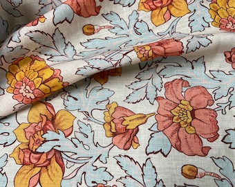 100% Linen designer print, Ivory base with burnt orange yellow baby blue floral  designer printed linen. 58” wide Sold by the yard