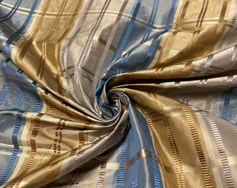100% silk beautiful beige tan mustard gold with turquoise shades silk satin & ribs taffeta 54" wide            Sold by the yard