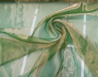 Beautiful green gold tissue matalic organza 45” wide.  Best used for apparel. Sold by the yard