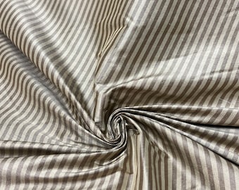 Beautiful 100 % silk shantung brown & beige tone stripe 54” wide.  Best used for apparel and home Decore.  Sold by the yard