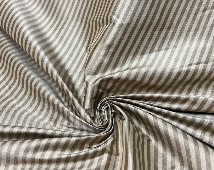 Beautiful 100 % silk shantung brown & beige tone stripe 54” wide.  Best used for apparel and home Decore.  Sold by the yard