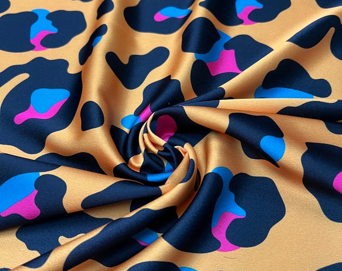 Soft Satin charmeuse digital print 54" wide   Beautiful mustard base with black pink blue branded leopard design   Fabric sold by the yard