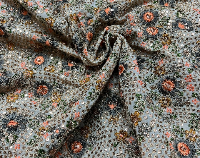Beautiful gray ivory base with orange silvers emb 46”wide    Beautiful artistic design floral sequenced & embroidered viscose soft chiffon.