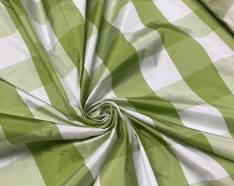 Beautiful parrot green and white taffeta plaids 54” wide.  Best used for home decor and appreal.  Sold by the yard