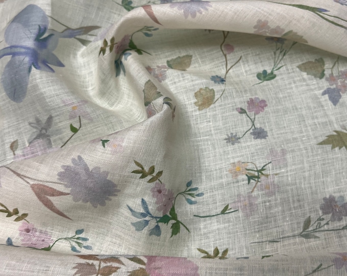 100% Linen designer print, Ivory base with lilac pinkish peach tiny floral  designer printed linen. 58” wide Sold by the yard