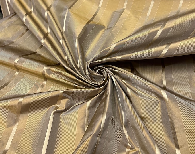 100% silk beautiful gold copper shades pinstripe with gold satin stripes.  silk satin taffeta 54" wide            Sold by the yard