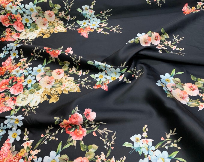 Mikado Zibelline printed fabric 54” wide. Beautiful black base floral design best used for apparel.  Sold by the yard