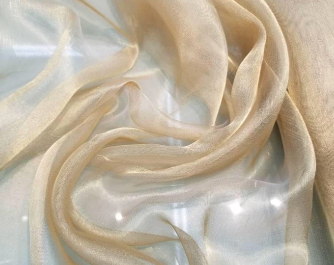 Metallic  tissue organza gold color  100% Silk Organza 45" wide fabric sold by the yard. Usable for Apparel and interior designing.