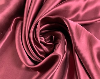 Beautiful wine color silk Charmouse 54” wide. Best used for apparel.  Sold by the yard