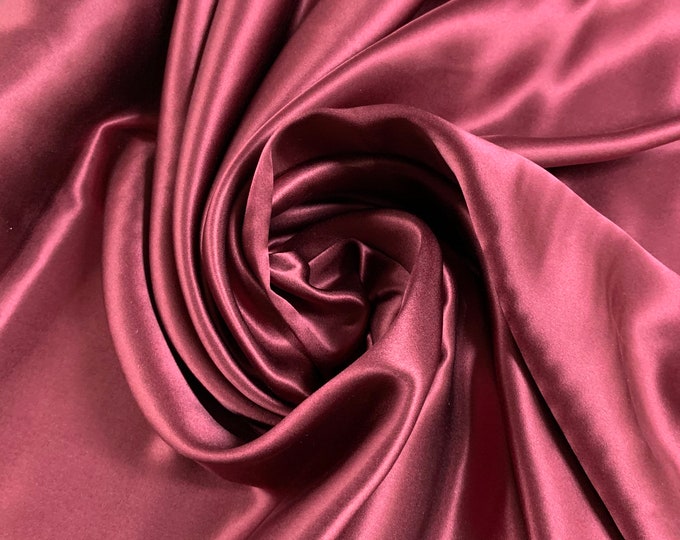 Beautiful wine color silk Charmouse 54” wide. Best used for apparel.  Sold by the yard