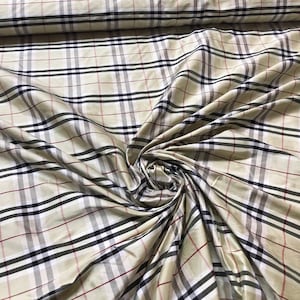 Beautiful silk shantung Plaid 54” wide. Beautiful pastel pear green base with black and white check. Best used for appreal and home decor