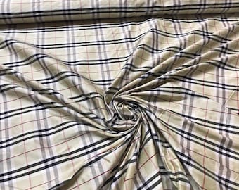 Beautiful silk shantung Plaid 54” wide. Beautiful pastel pear green base with black and white check. Best used for appreal and home decor