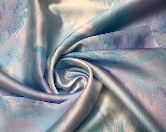 Beautiful ocean blue purple shades abstract design digital print on silky satin 54” wide. Sold by the yard. Best used for apparel