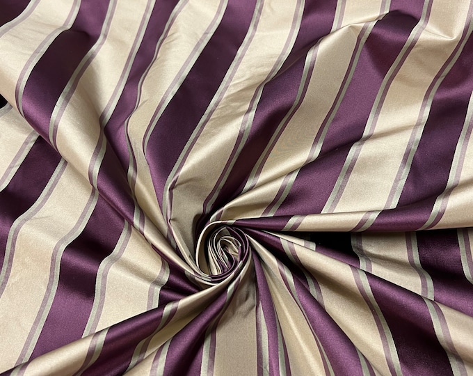100% silk beautiful beige light gold with bright purple silk satin stripes.  silk satin taffeta 54" wide            Sold by the yard
