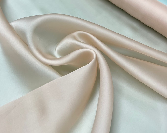 100% silk satin face organza, beautiful rose pink peach color Silk satin organza also called silk Gazzar. 54” wide. Sold by yard