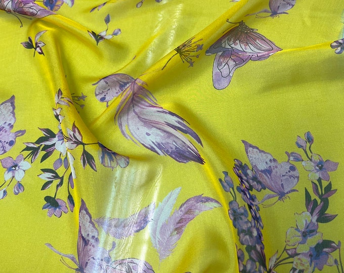 100% silk satin face chiffon digital print 54" wide    Beautiful bright yellow base with purple floral & butterfly design