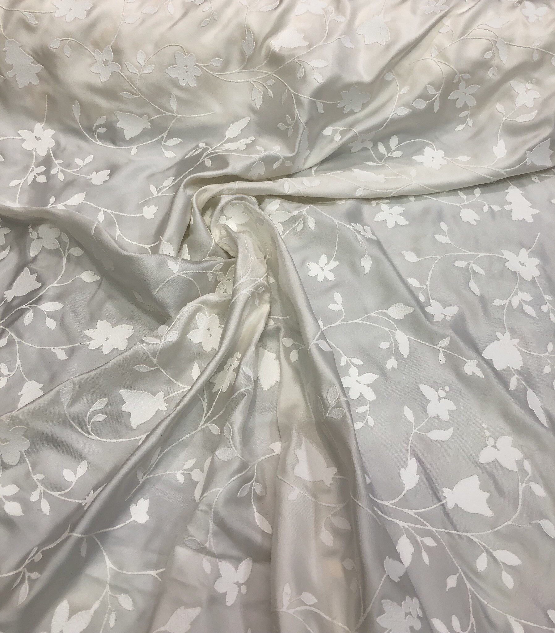 100 silk twill with embosed floral design, beautiful ivory color 60