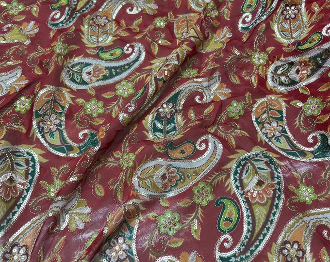 Bright Red base with multi color print 46”wide    Beautiful artistic design Pasely style sequenced embroidered viscose soft chiffon.