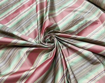 Beautiful white, gold, tan green shades stripe silk taffeta, best used for home decor & apparel.  Sold by the yard