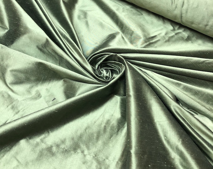 Beautiful basil green iridescent silk shantung 54” wide.  Best used for home decor sold by the yard