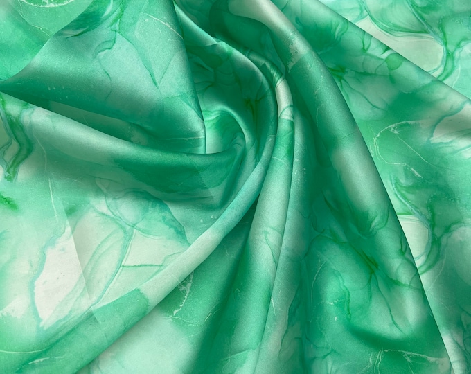 100% silk satin face organza, also called silk Gazzar 54” wide. Beautiful painting style abstract design green ivory shades digital design.