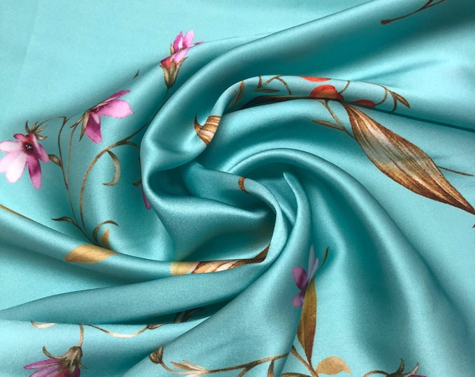 100% silk satin charmeuse digital print 54" wide    Beautiful turquoise base with floral print silky soft fabric 54” wide