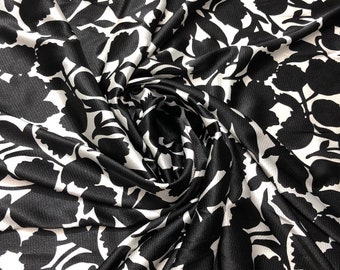 Satin charmeuse print 54" wide    Beautiful black and white floral design     Fabric sold by the yard