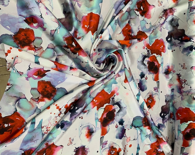 100% silk satin Charmouse 54” wide.  Beautiful white gray base floral print beat use for apparel.  Sold by the yard