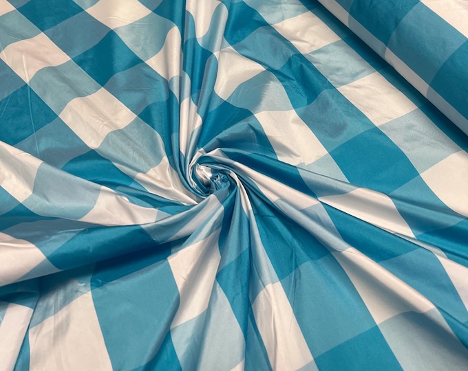 Beautiful Turquise and white taffeta plaids 54” wide.  Best used for home decor and appreal.  Sold by the yard