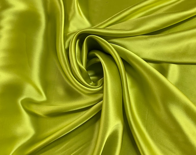 Beautiful parrot green silk Charmouse 54” wide.  Best used for apparel. Sold by the yard