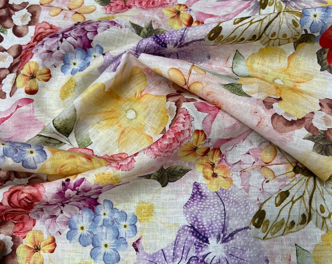 100% Linen designer print, Ivory base with rainbow colors allover floral designer printed linen. 58” wide Sold by the yard