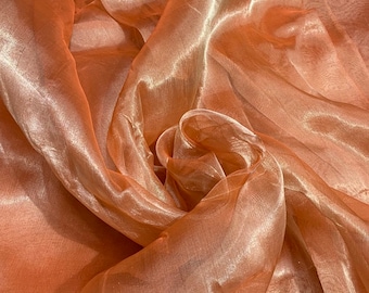 Matalic tissue organza 45" wide   Beautiful matalic orange color sold by the yard   Best use for appreal & home decor