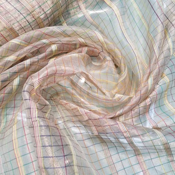 Metallic  tissue organza rainbow striped check design on gold base color  100% Silk Organza 45" wide. Usable for Apparel and interior design