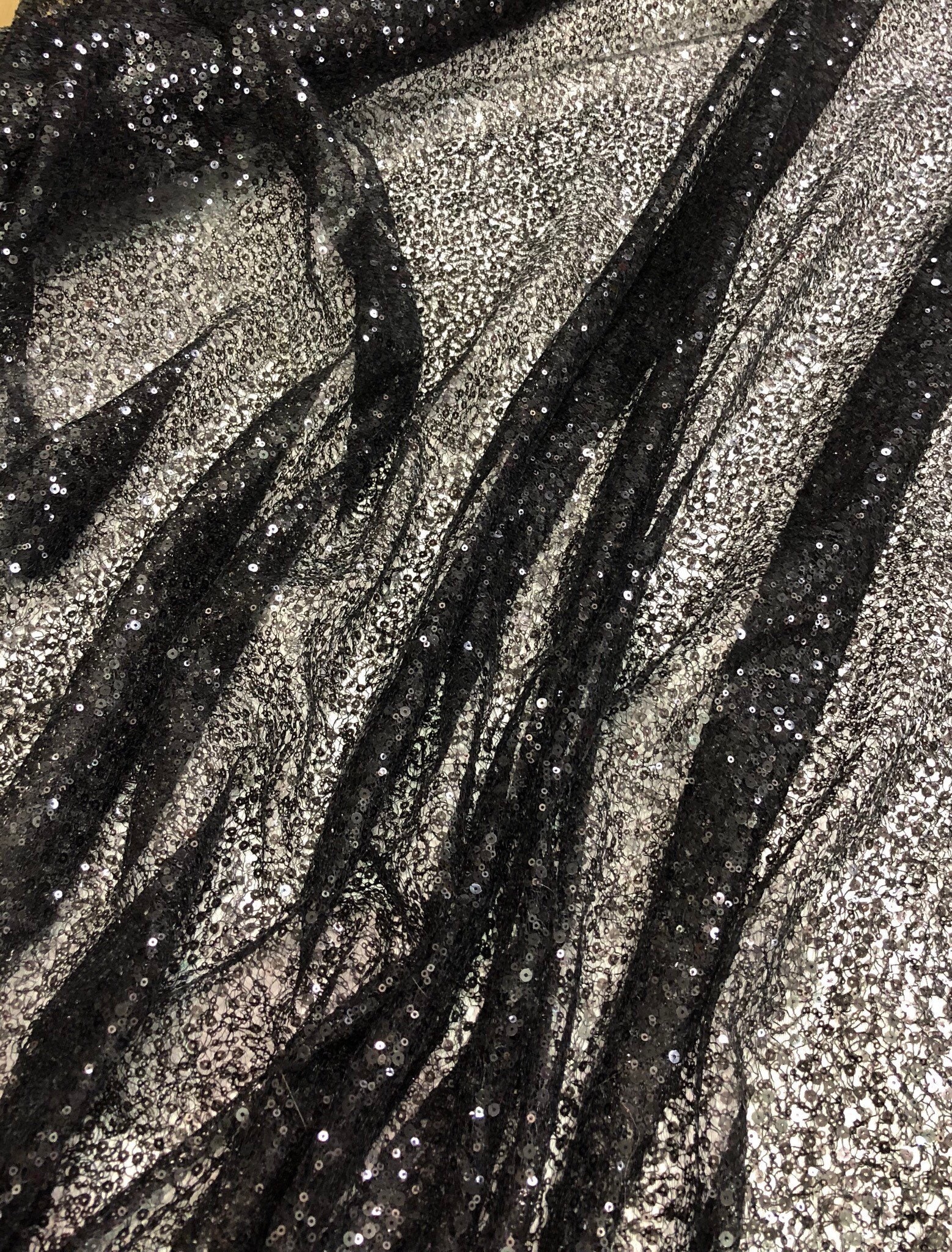 Black sequins on swirl meah fabric 52 wide Fabric sold by the yard