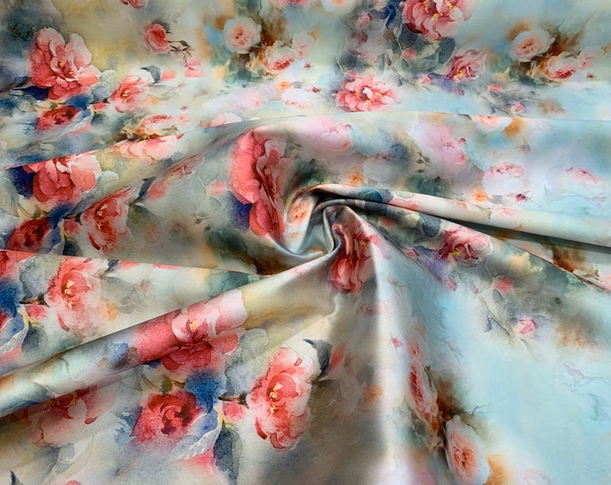 Mikado Zibelline printed fabric 54” wide.  Beautiful beige base tie die floral print beat used for apparel.  Sold by the yard