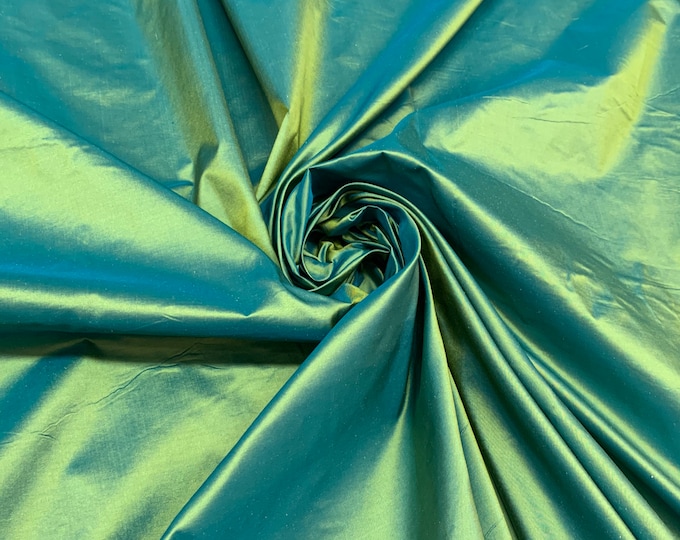 Beautiful bright green Irredescent 100% silk taffeta 54” wide.  Best used for apparel and home Decore.  Sold by the yard