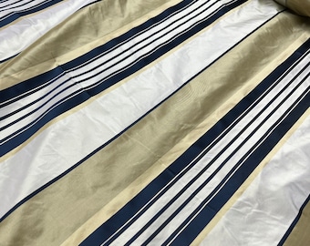 Beautiful Gold base with ivory gold tan with Dark navy silk taffeta satin stripes, best used for home decor & apparel.  Sold by the yard