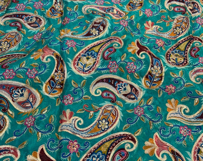 Bright Turquoise base with multi color print 46”wide    Beautiful artistic design Pasely style sequenced embroidered viscose soft chiffon.