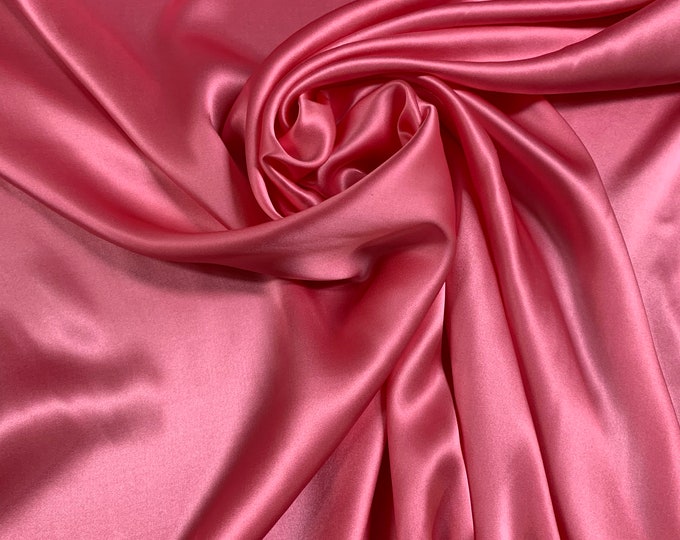 Beautiful rose pink 100% silk Charmouse 54” wide. Best used for apparel.  Sold by the yard