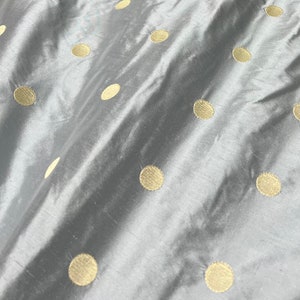 Beautiful 100% silk shantung embroidery 54” wide. Baby blue base color with champagne gold polka dot embroidery. Best used for home Decore image 10