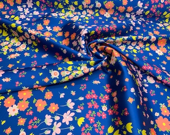 Mikado Zibelline printed fabric 54” wide.  Beautiful royal blue multi color floral design best used for apparel.  Sold by the yard.
