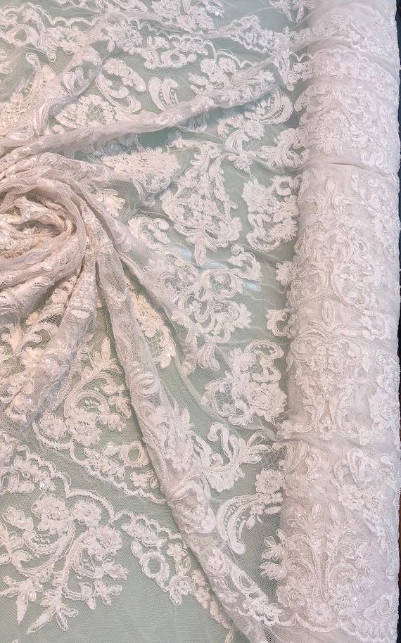 WHITE FLORAL BEADED DESIGN EMBROIDER WITH SEQUINS ON A MESH LACE-SOLD BY YARD