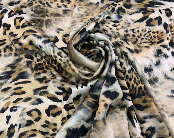 Digital satin Charmouse print 54” wide.  Beautiful gold shades leopard animal print beat used for apparel.  Sold by the yard
