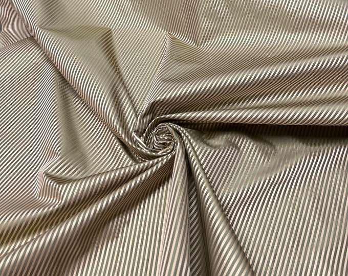 100% silk satin stripe beautiful sage green with gold silk satin stripes.  silk satin taffeta 54" wide            Sold by the yard