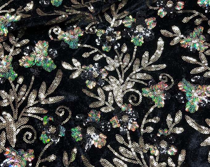 Velvet with sequence embroidered 45" wide   Beautiful black velvet with floral leaves sequence florescent green golden. sold by the yard