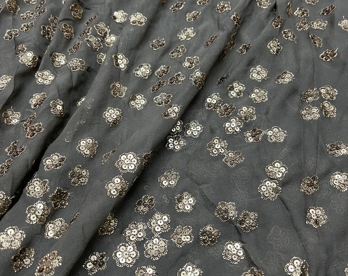 Beautiful dark gray base with Matte gold embroidered chiffon 46”wide    Beautiful floral sequenced embroidered viscose soft chiffon.