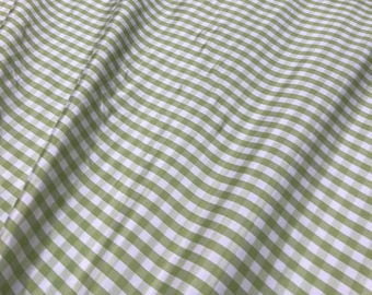 Beautiful taffeta Parrot Green & white gingham check 54” wide.  Best used for apparel and home Decore.  Sold by the yard